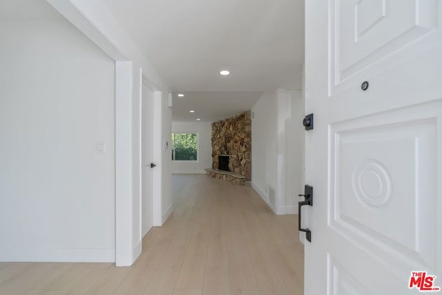 hall with light hardwood / wood-style flooring