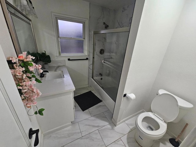 full bathroom with vanity, toilet, and combined bath / shower with glass door