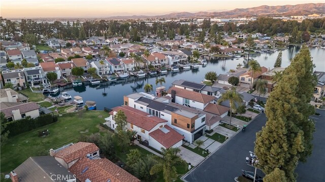 aerial view at dusk with a water view