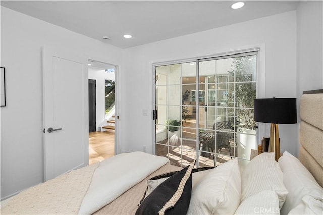 bedroom with hardwood / wood-style floors