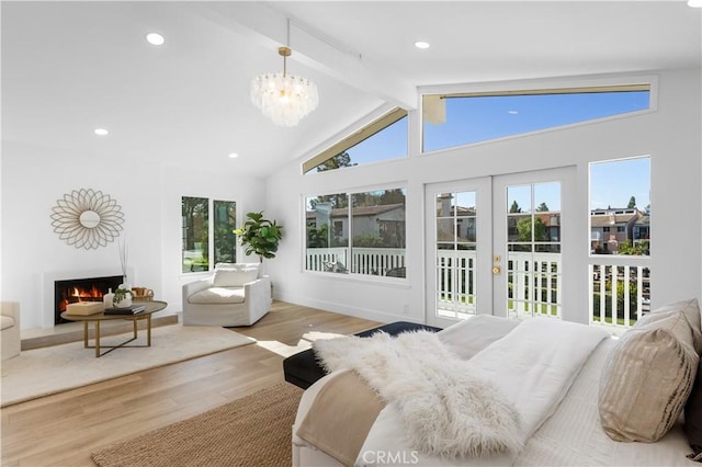 bedroom with high vaulted ceiling, access to outside, french doors, beamed ceiling, and light hardwood / wood-style floors