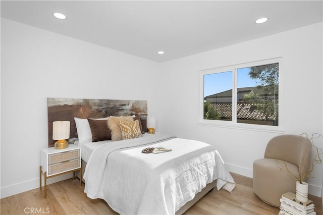 bedroom with light wood-type flooring