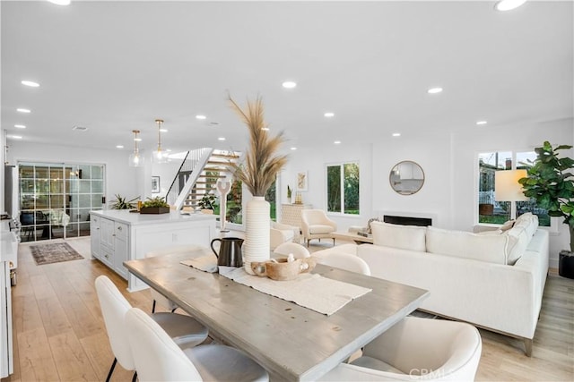 dining space with light hardwood / wood-style floors