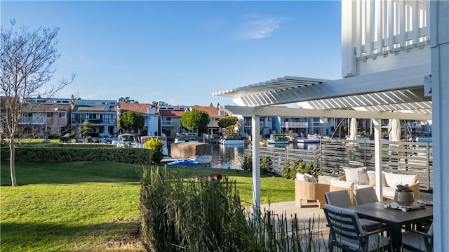 view of home's community featuring a lawn, a water view, and a pergola