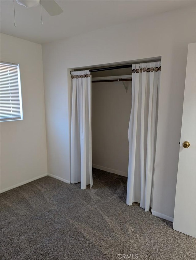 unfurnished bedroom with carpet flooring and ceiling fan