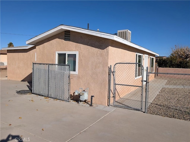 view of property exterior with central AC