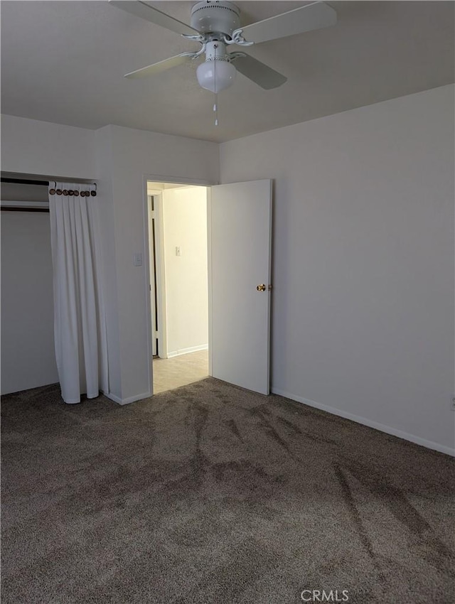 unfurnished bedroom with carpet flooring and ceiling fan