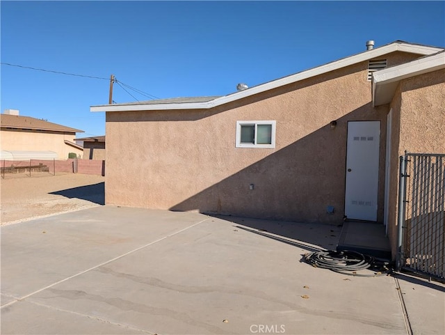 back of house featuring a patio area