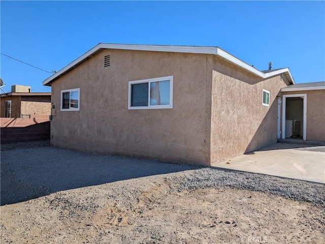 rear view of property featuring a patio area