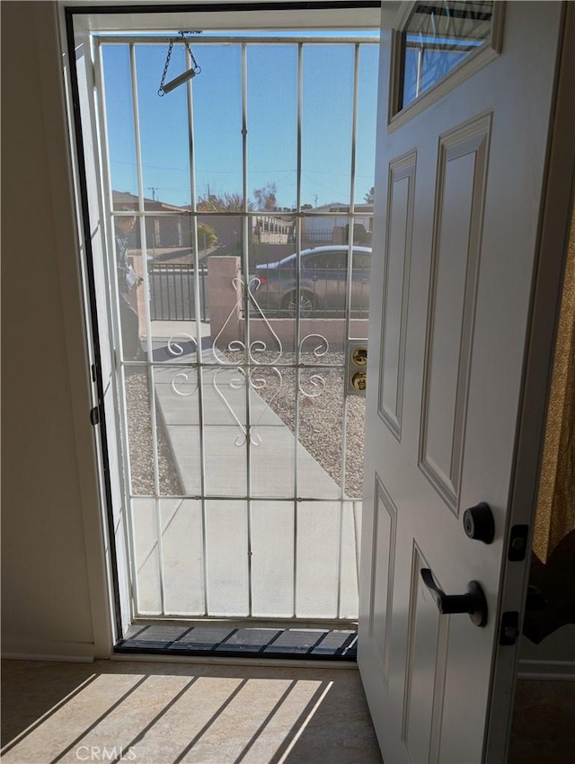 doorway to outside featuring a healthy amount of sunlight