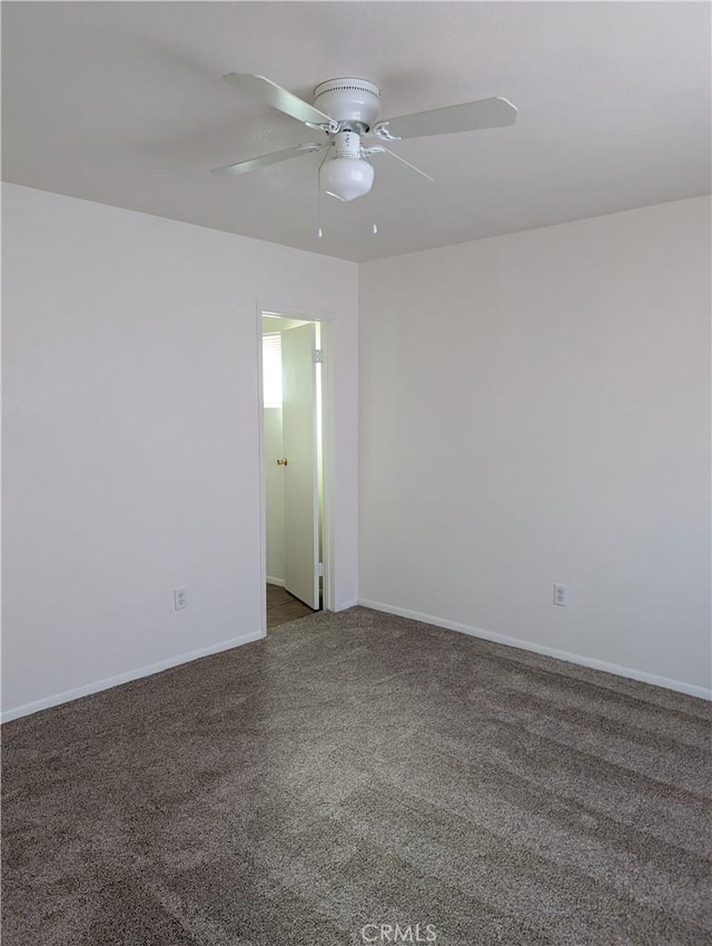 unfurnished room featuring carpet and ceiling fan