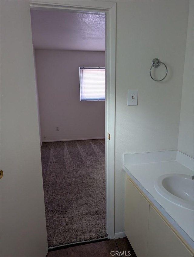 bathroom with vanity and a textured ceiling