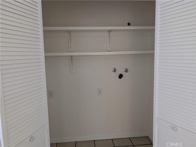 laundry room featuring light tile patterned floors