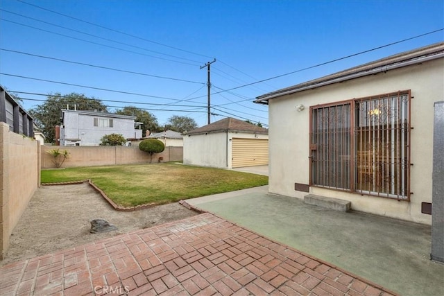 view of patio / terrace with a fenced backyard and an outdoor structure