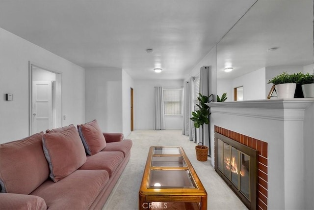 living area featuring light colored carpet and a fireplace