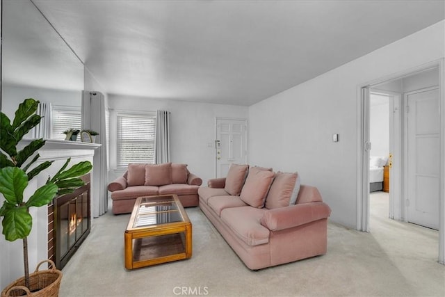 living area featuring light colored carpet