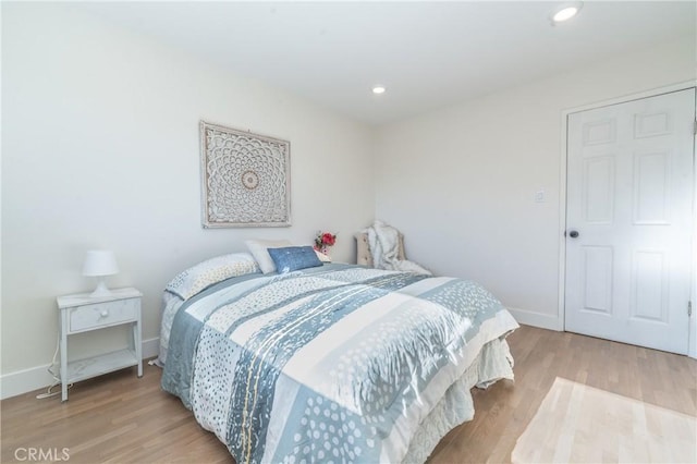 bedroom with light wood-type flooring