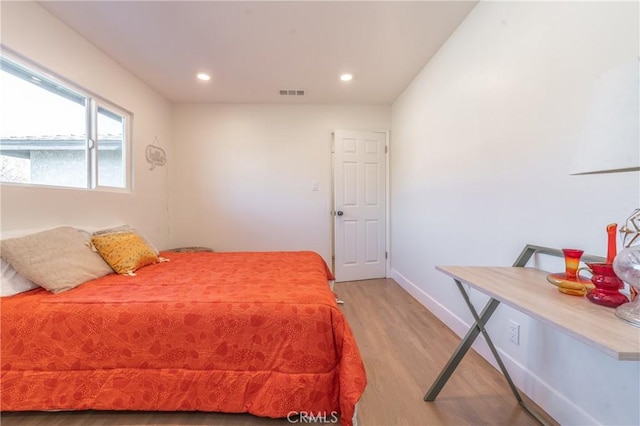 bedroom featuring light hardwood / wood-style floors