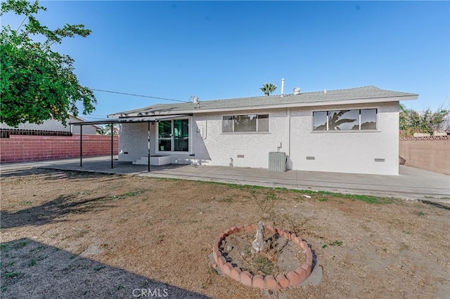 back of property with a patio area