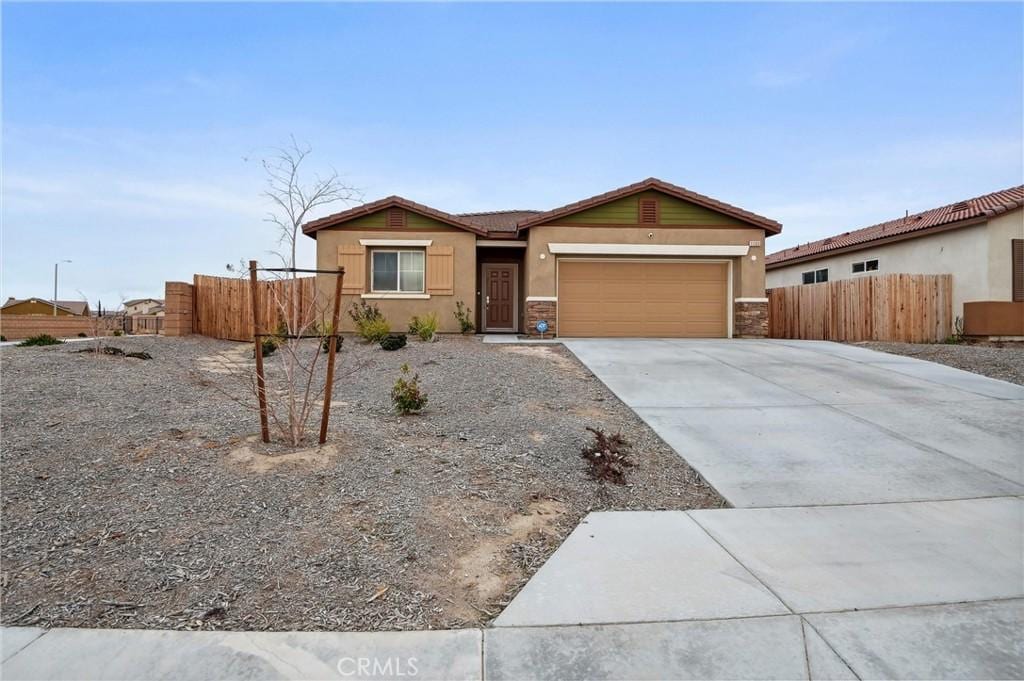 ranch-style home featuring a garage