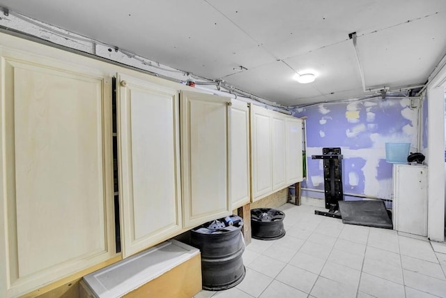 basement featuring light tile patterned floors