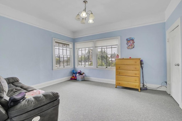 living area featuring carpet and a notable chandelier