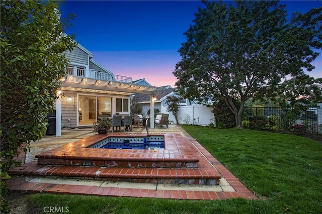 exterior space with a patio area, a pergola, and a yard