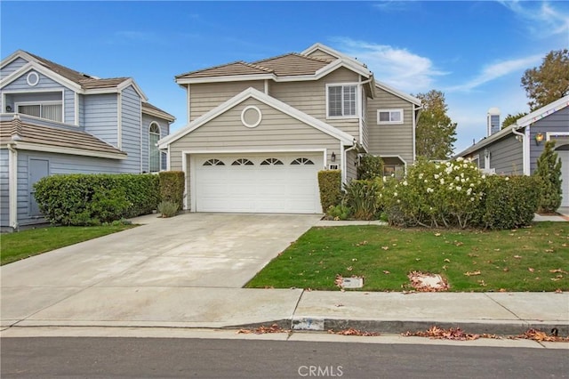 front facade with a garage and a front yard