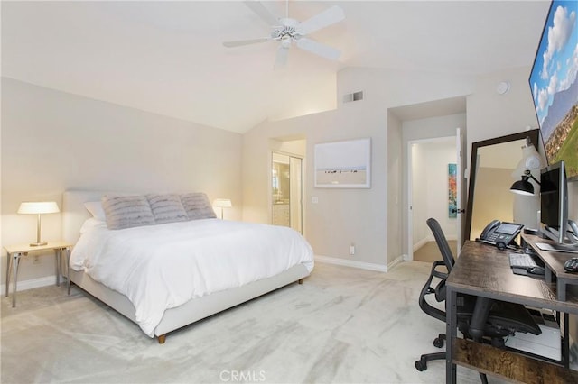 bedroom featuring ceiling fan, light colored carpet, lofted ceiling, and ensuite bathroom