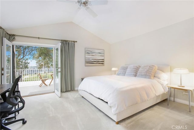 carpeted bedroom with access to exterior, ceiling fan, and vaulted ceiling