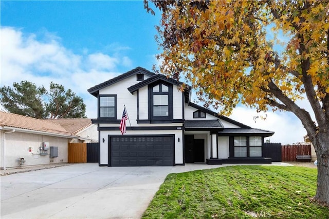 view of front of house with a front lawn and a garage