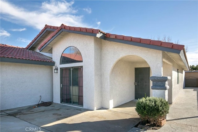 doorway to property with a patio