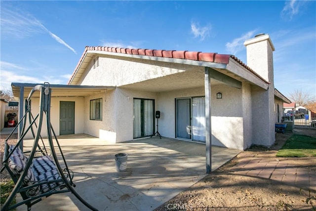 rear view of property with a patio area