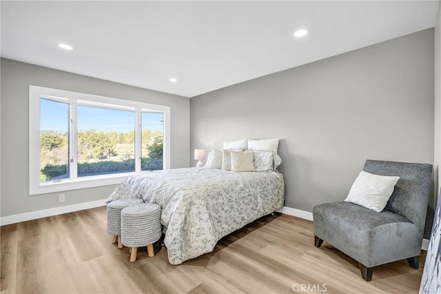 bedroom with hardwood / wood-style flooring