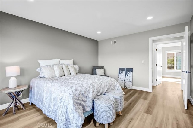 bedroom with wood-type flooring