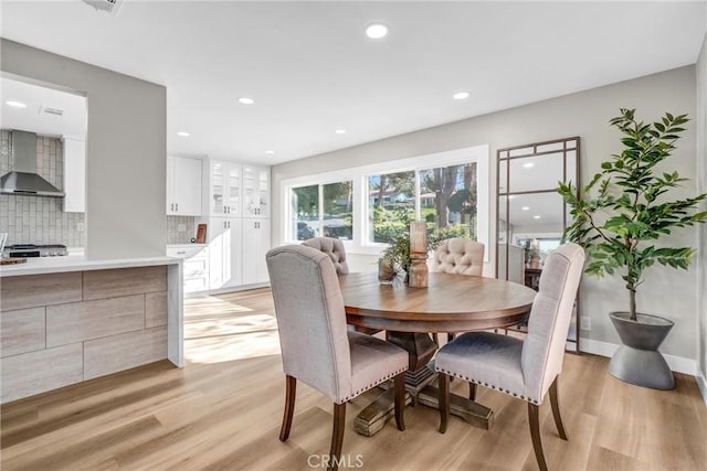 dining room featuring light hardwood / wood-style flooring