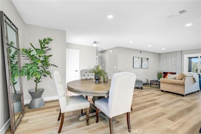 dining room with light hardwood / wood-style flooring