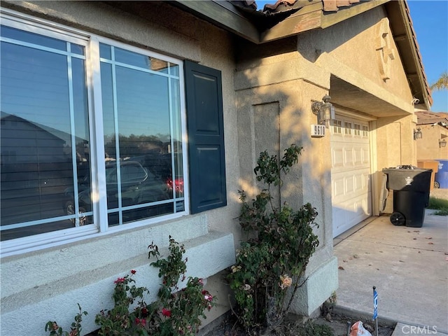 view of side of home with a garage