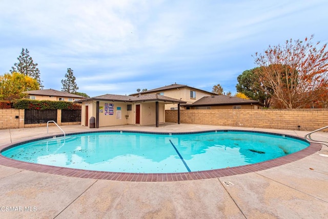 view of swimming pool with a patio area