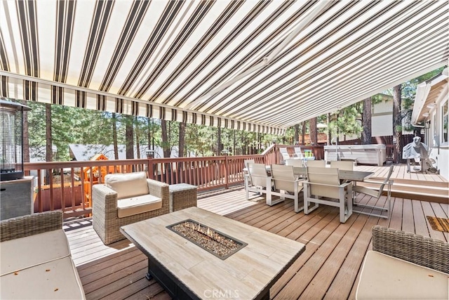 wooden terrace with a hot tub