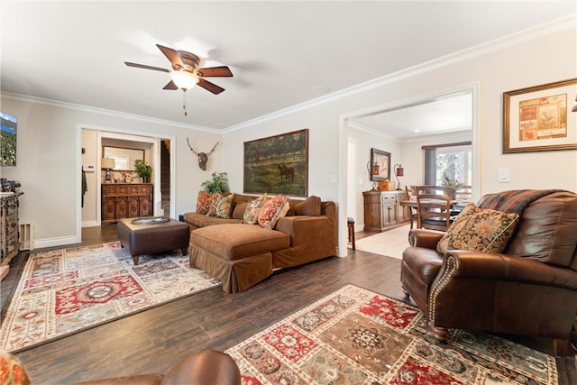 living room featuring ceiling fan, dark hardwood / wood-style flooring, and ornamental molding