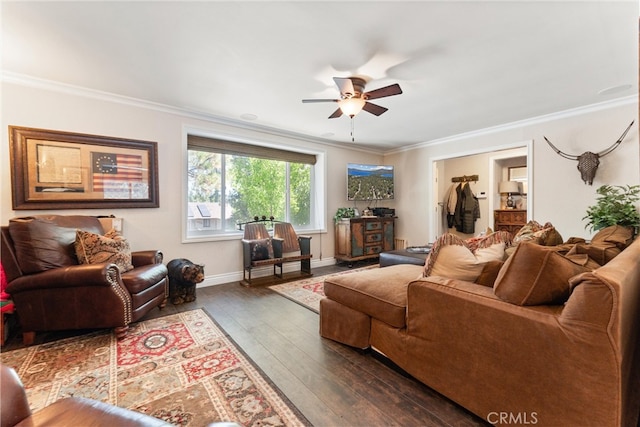 living room with dark hardwood / wood-style floors, ceiling fan, and crown molding