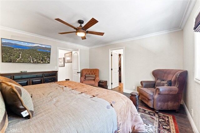 bedroom with ceiling fan, dark hardwood / wood-style floors, and ornamental molding