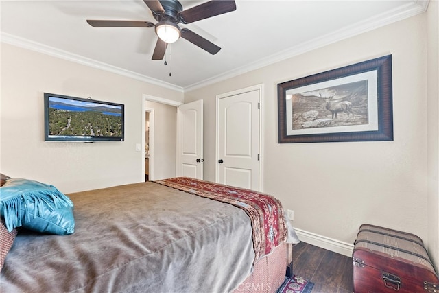 bedroom with ceiling fan, dark hardwood / wood-style flooring, and crown molding