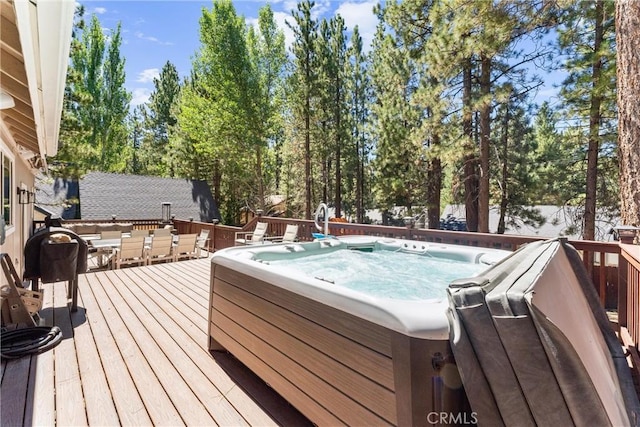 wooden terrace with a hot tub