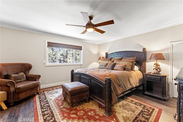 bedroom featuring ceiling fan, wood-type flooring, and crown molding