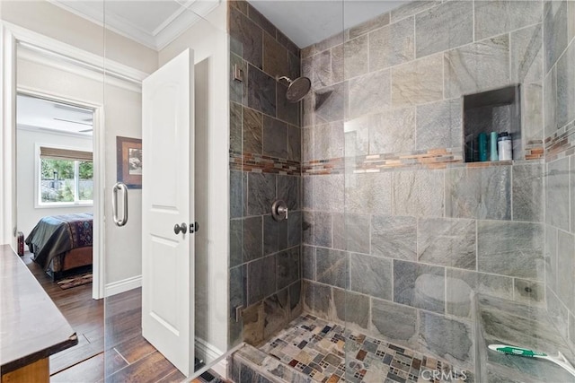 bathroom featuring hardwood / wood-style floors, an enclosed shower, and ornamental molding