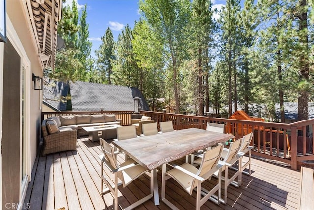 wooden deck featuring outdoor lounge area