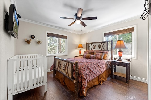 bedroom featuring ceiling fan, crown molding, and dark hardwood / wood-style floors