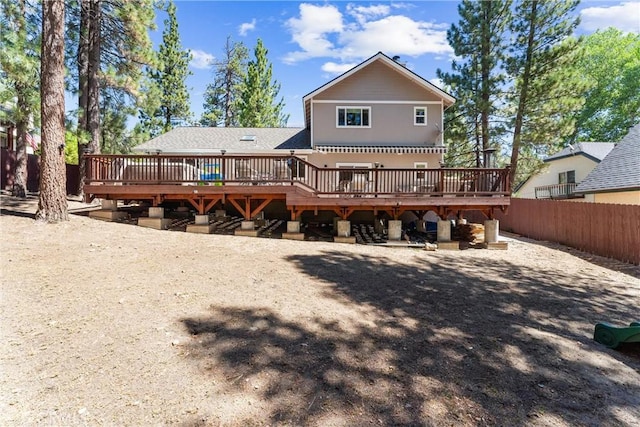 back of property with a wooden deck